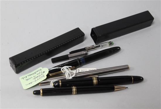 Three Montblanc fountain pens and a pencil